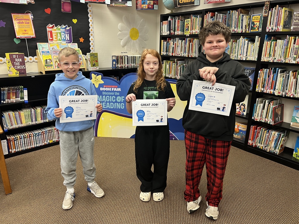 Three students earn their Typing certificate in Mrs. Armstrong's class.