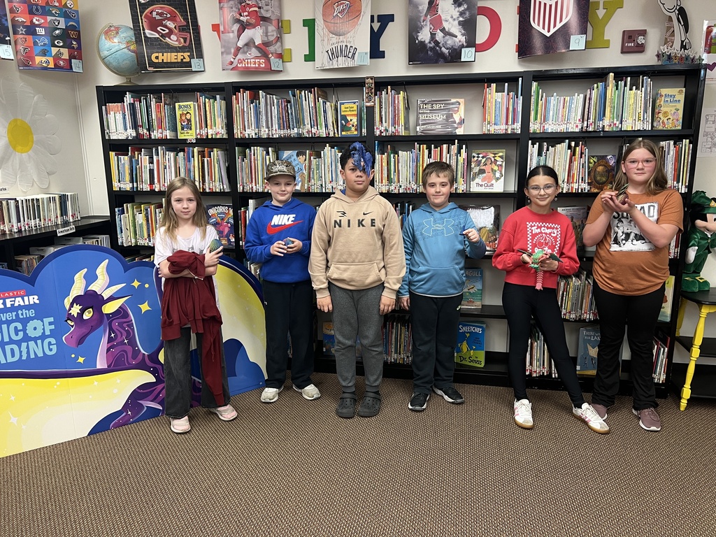 Fourth grade Book Fair Winners of dragon items  (3D dragon, dragon with egg, and dragon egg fidget)