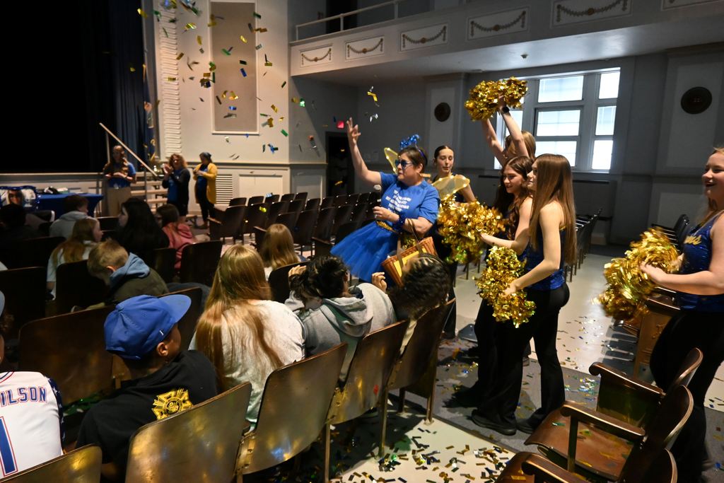 The Testing Fairy tosses Dust of Knowledge on students.