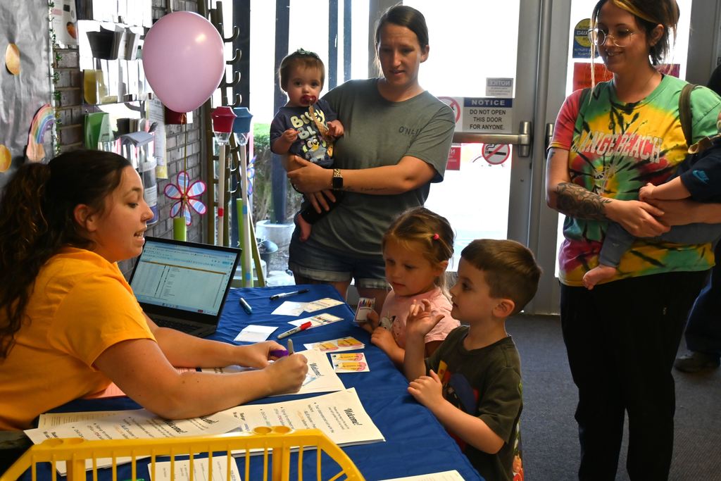 Children enter Lincoln and get a name tag.