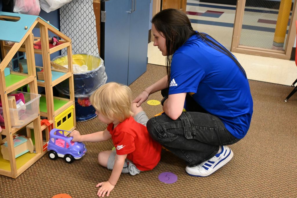 A mom plays with her son.