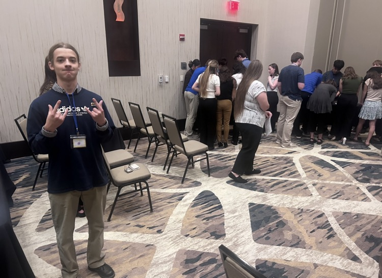 Oliver Helton with the workshop he led. Key Clubbers got jobs and had to balance their budgets through bills and emergencies  