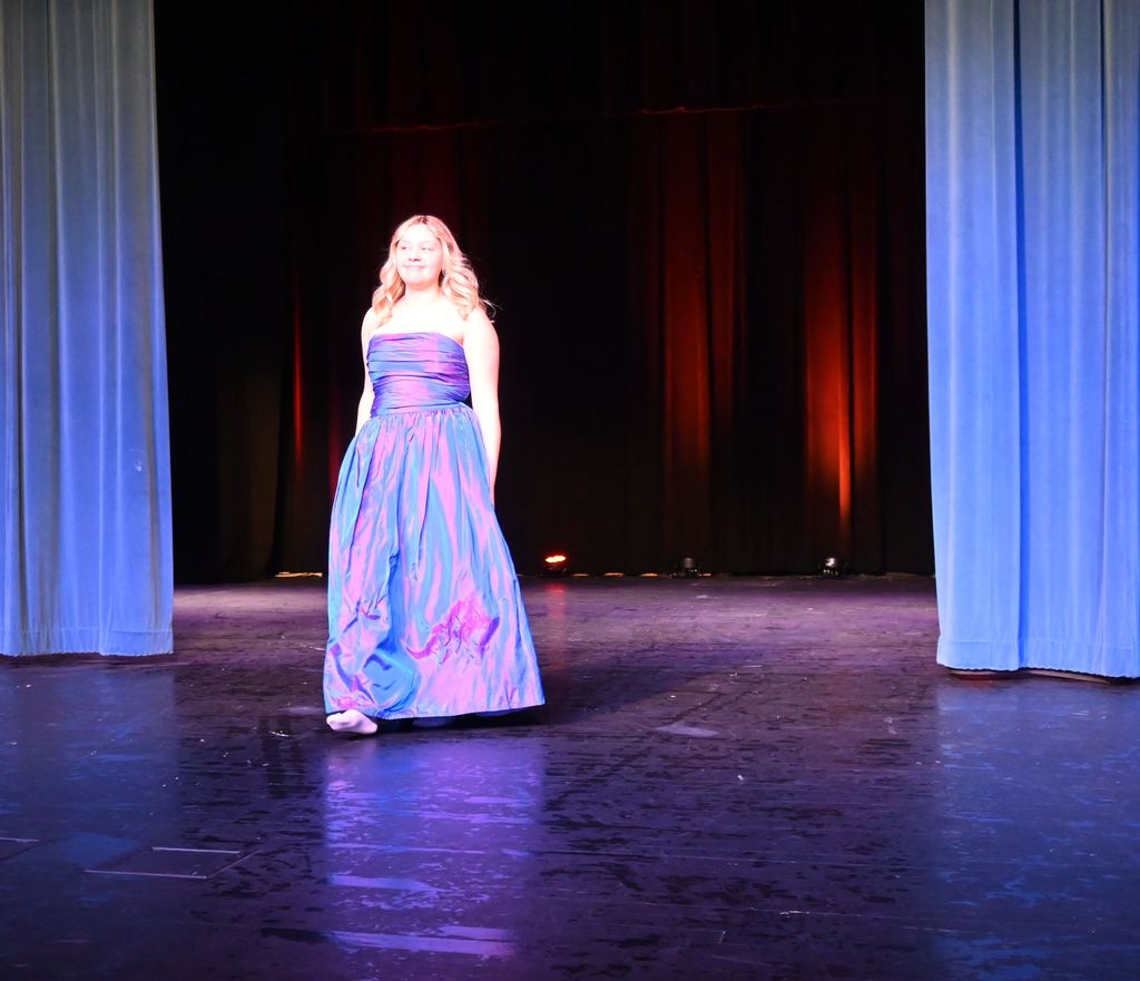 A girl models a prom dress.