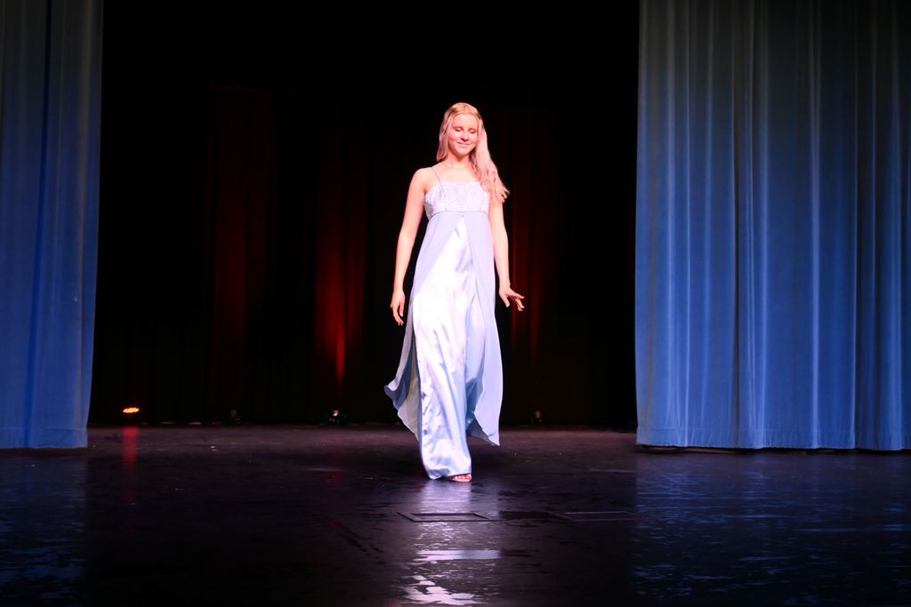 A girl models a prom dress.