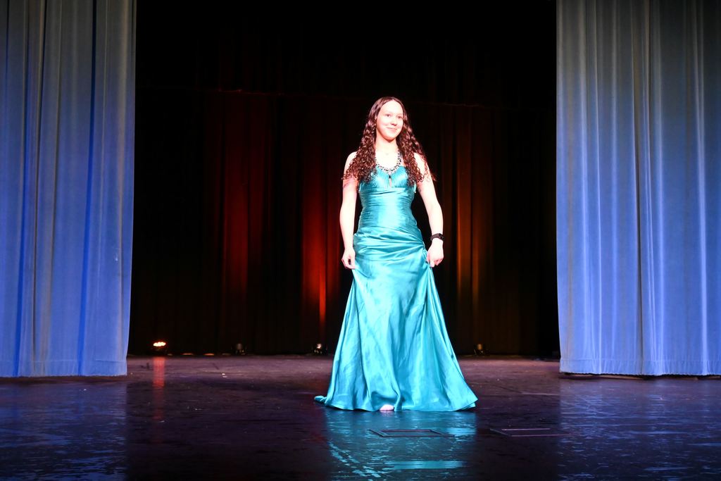 A girl models a prom dress.
