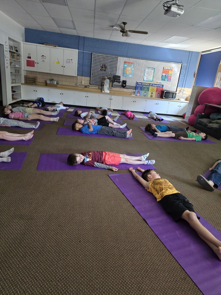 children laying on yoga mats