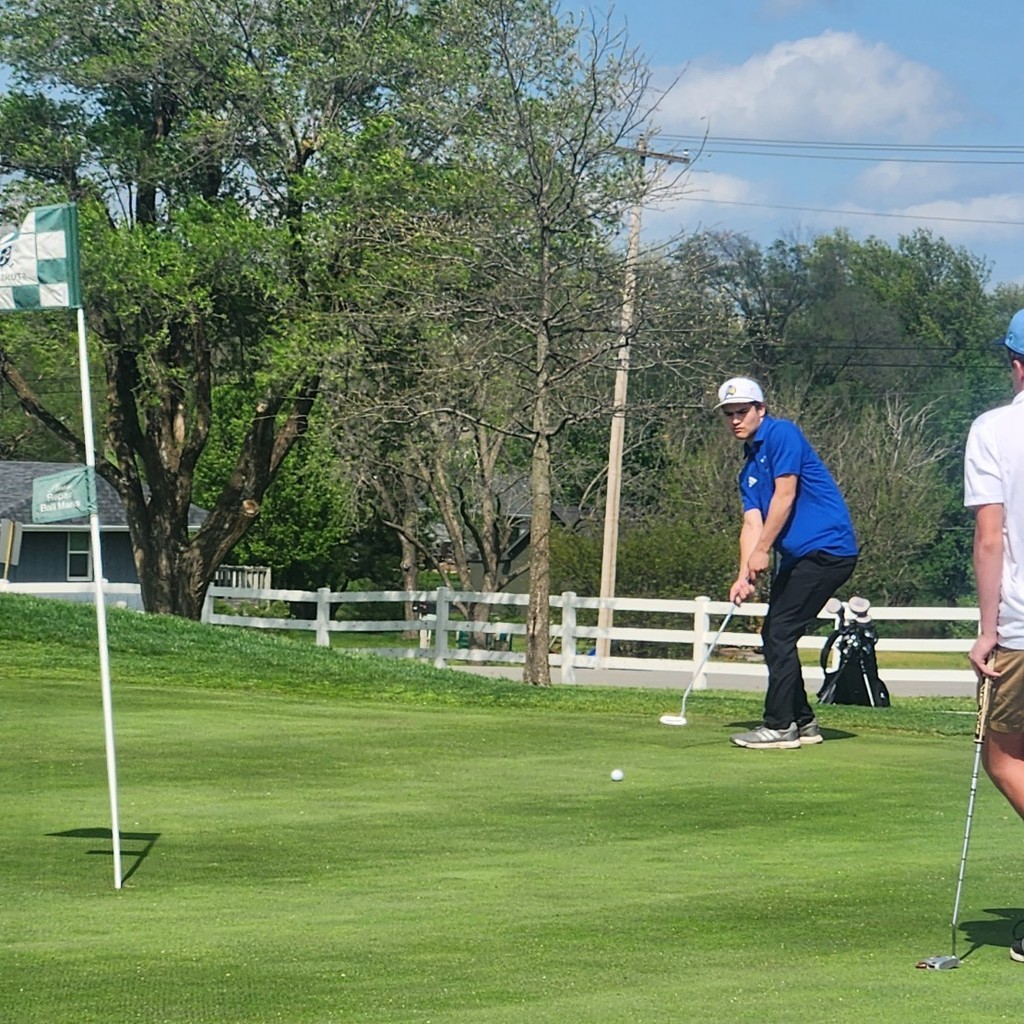 Grayson Bolt hits a downhill putt on number 3.