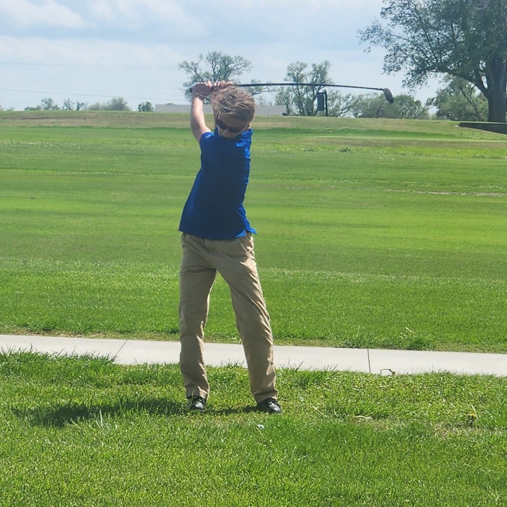 Oliver Helton hits his second shot on number 3.