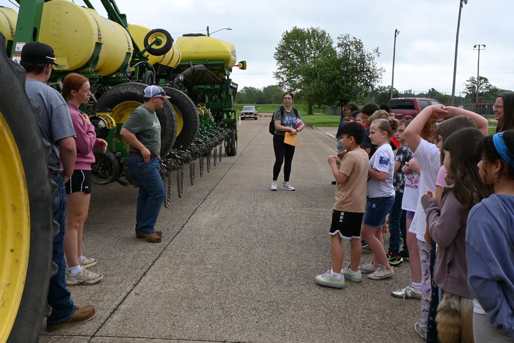 Students learn about large farm equipment and implements. 
