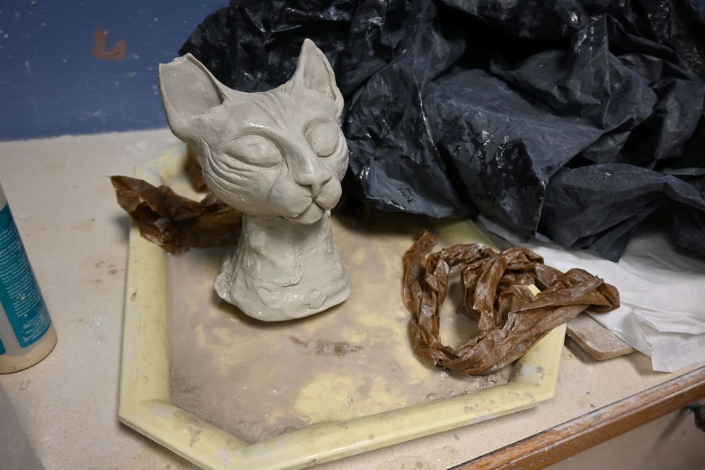 A sculpture of a hairless cat.