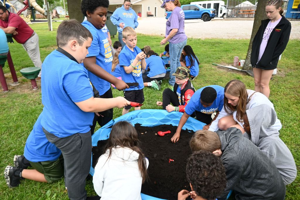 Student dig for artifacts.