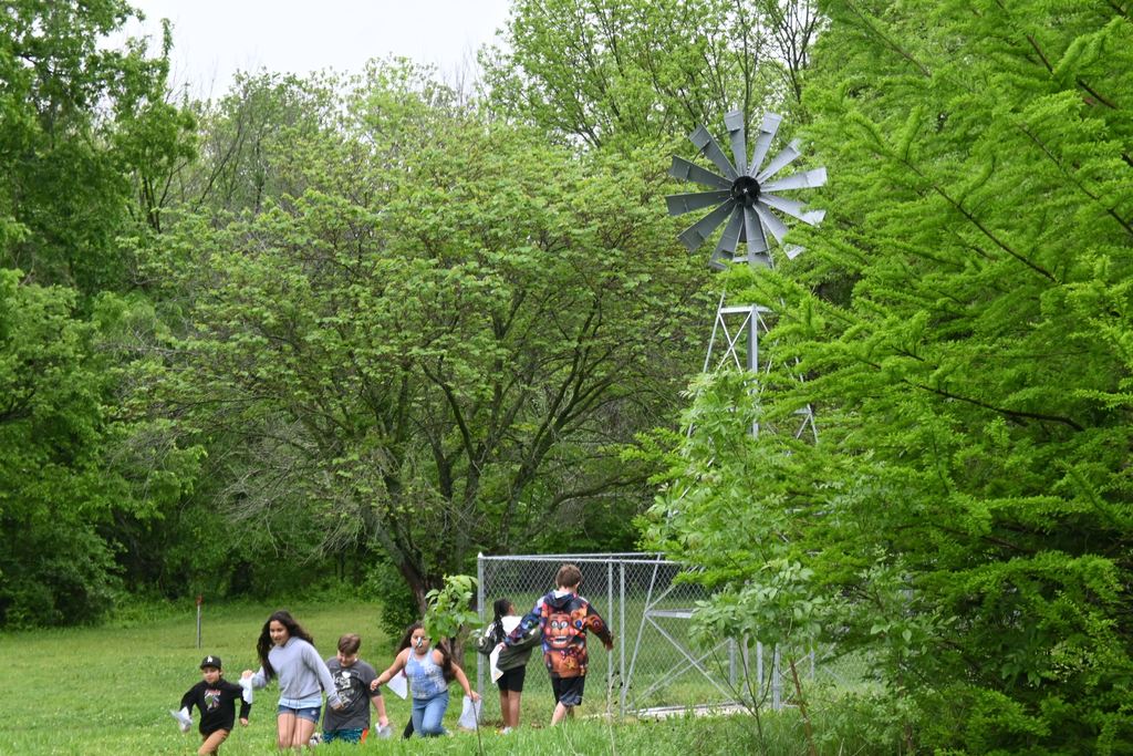 Students run to the windmill and back.