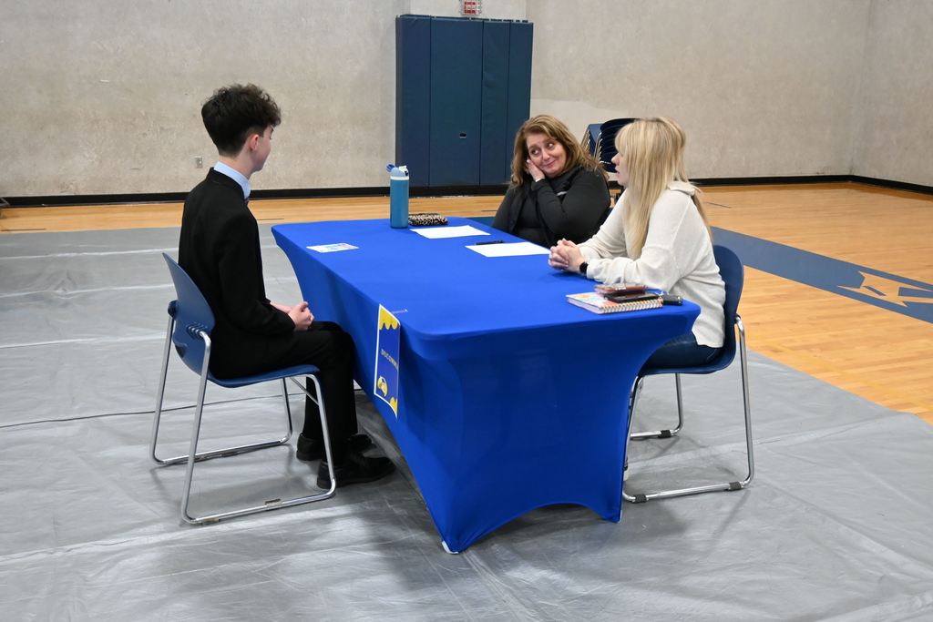 A student interviews for a job.