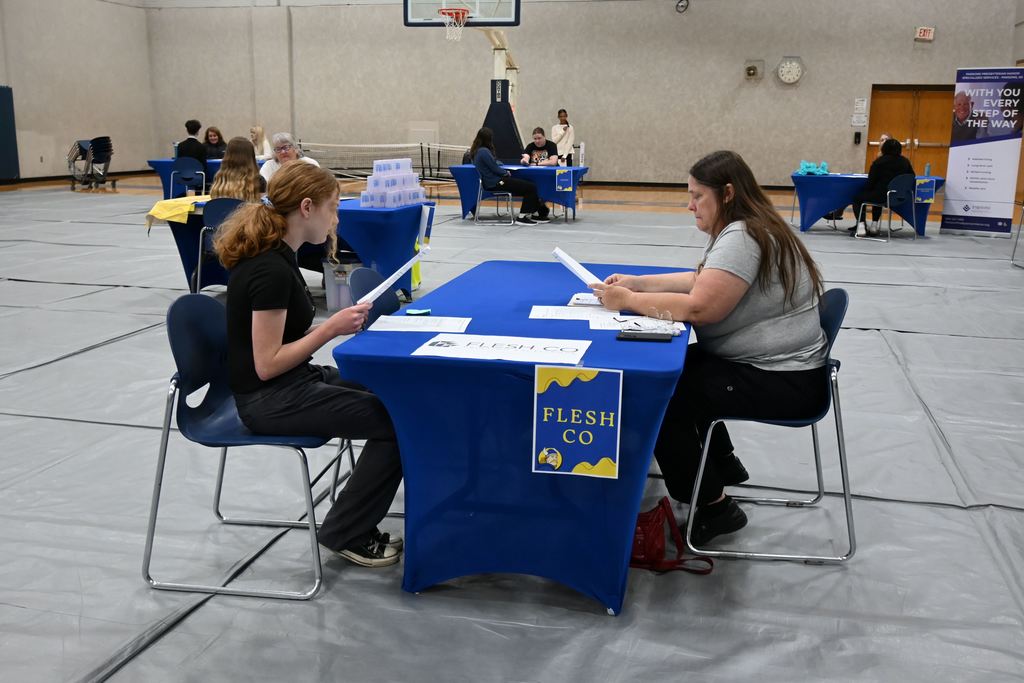 A student interviews for a job.