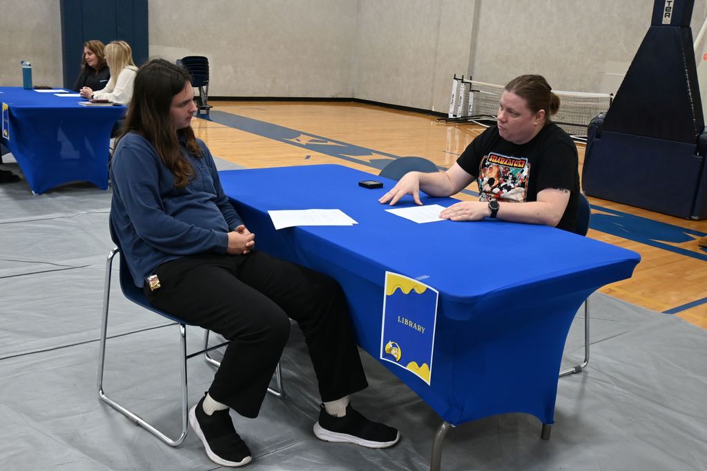 A student interviews for a job.