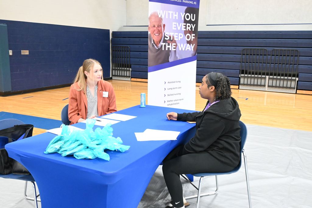 A student interviews for a job.