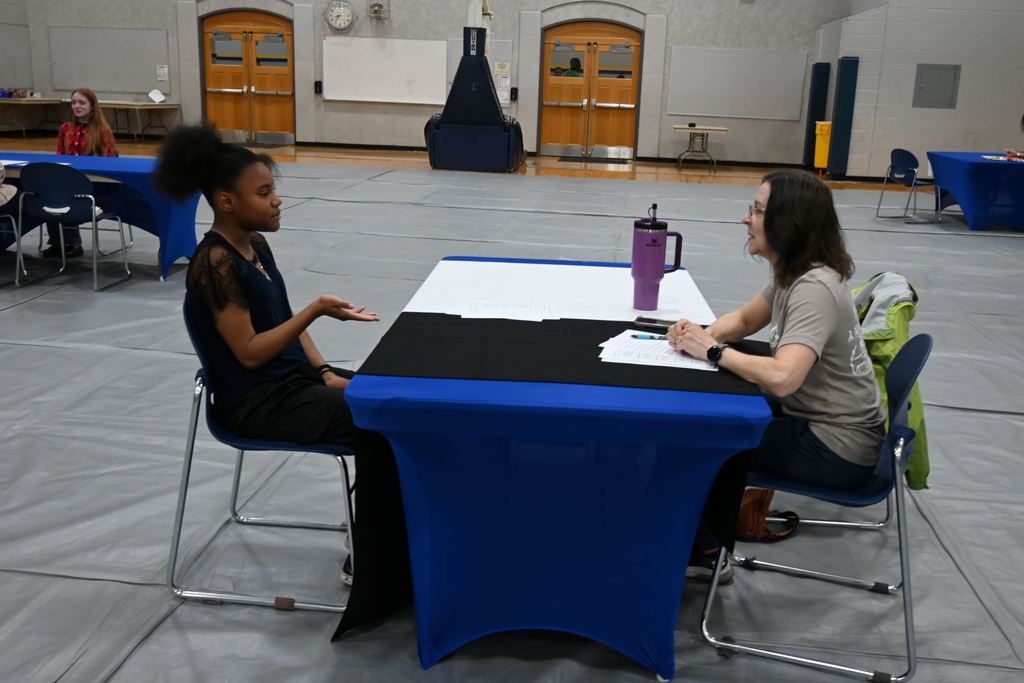 A student interviews for a job.