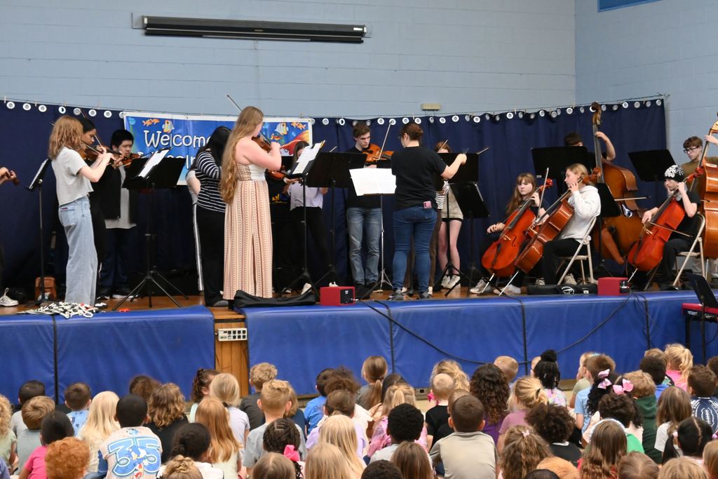 Orchestra plays for Lincoln students.