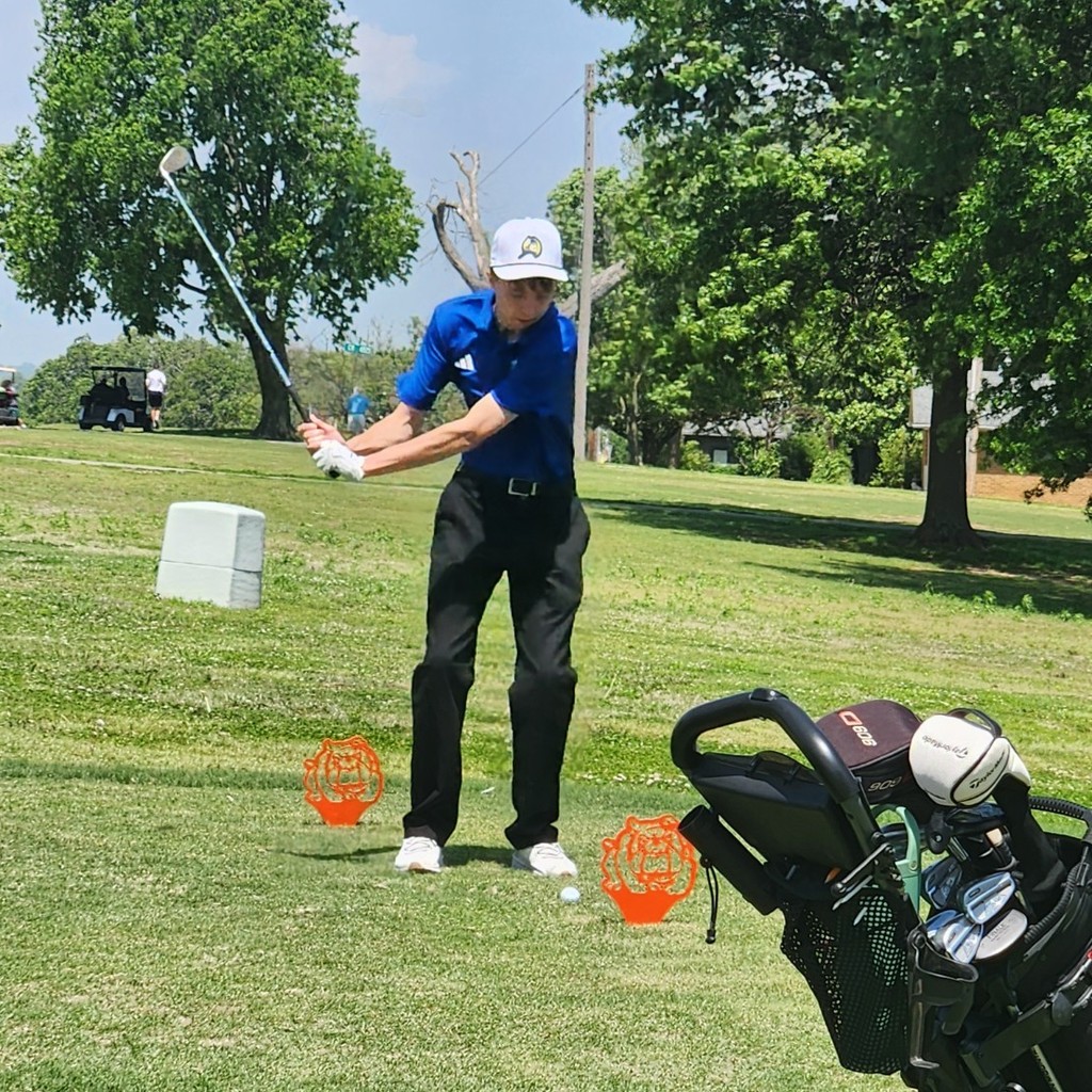 Brody mid swing on the number 1 tee box.