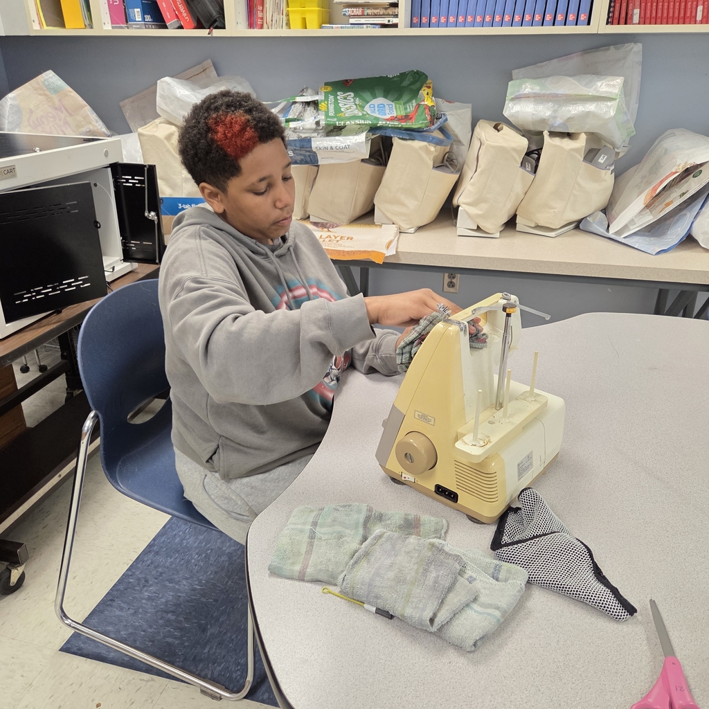 boy cleans sewing machine