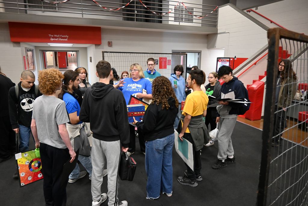 Student receive instructions about where they are supposed to display their art.