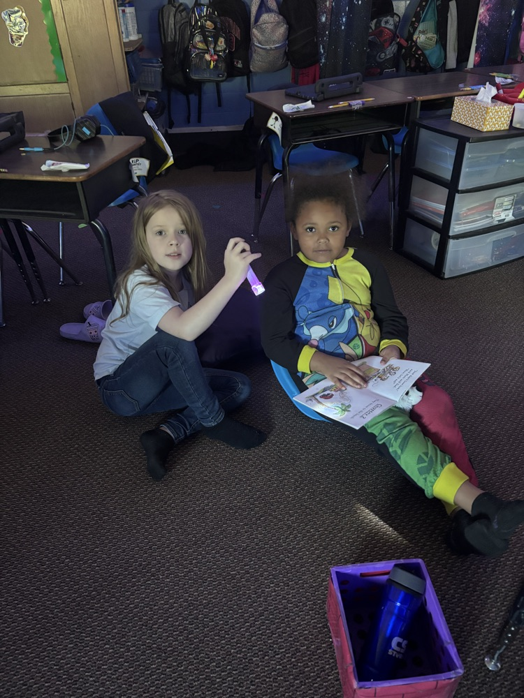 We are reading up a storm for our read-a-thon day. Nothing like curling up with a good book and friend. 