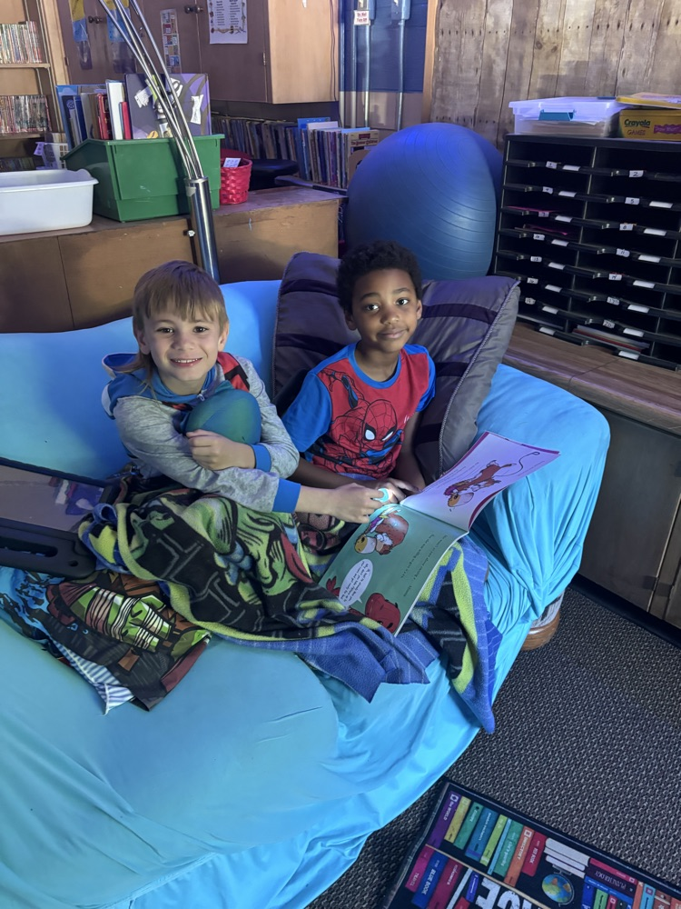 We are reading up a storm for our read-a-thon day. Nothing like curling up with a good book and friend. 