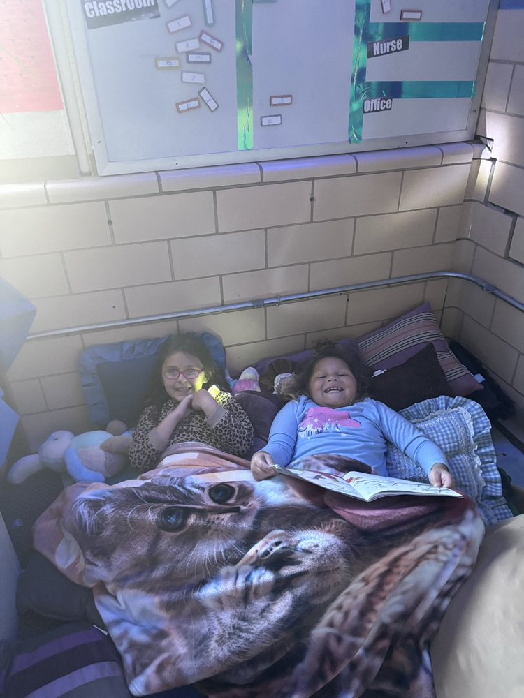 We are reading up a storm for our read-a-thon day. Nothing like curling up with a good book and friend. 