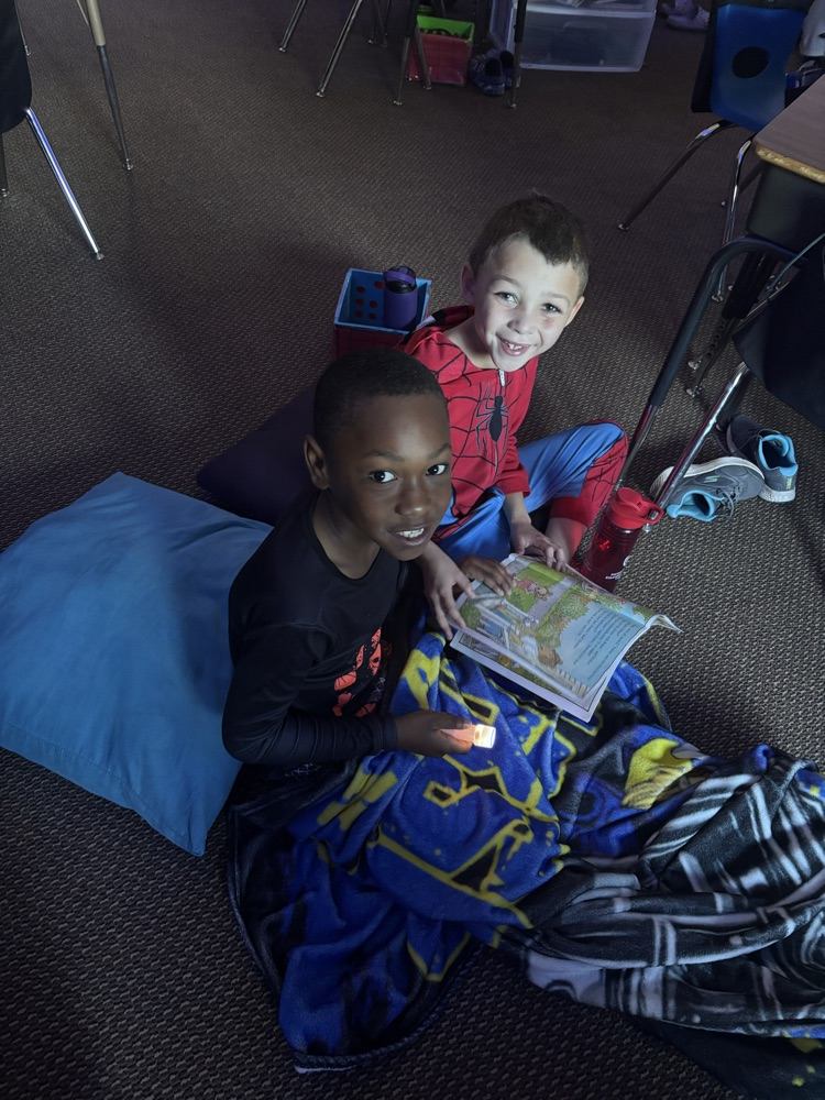 We are reading up a storm for our read-a-thon day. Nothing like curling up with a good book and friend. 