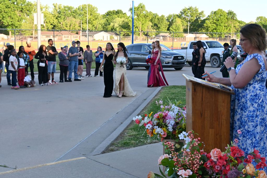Two girls arrive at prom for walk in.