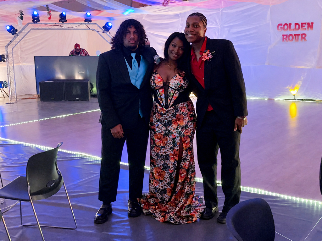 Friends pose for a picture at prom.