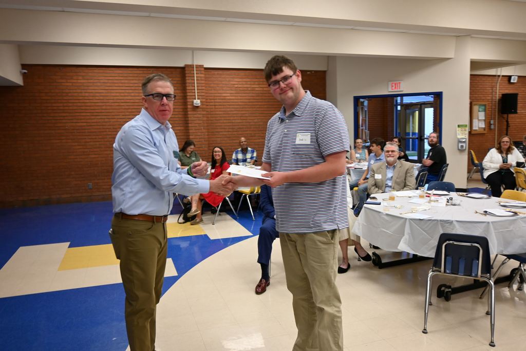 Wayne Gilmore  presents a scholarship to Jack Curtis.