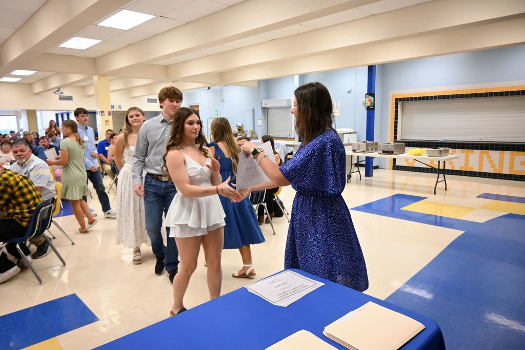 Scholarships are handed out to students.