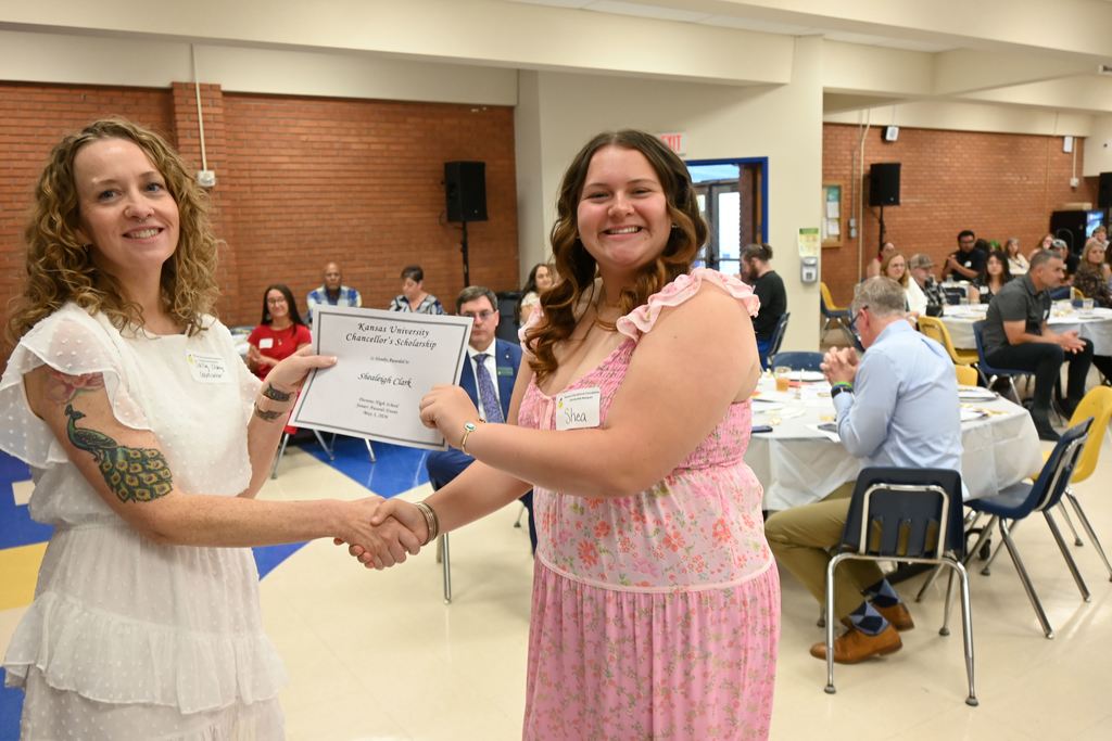 Sally Clay presents a scholarship.