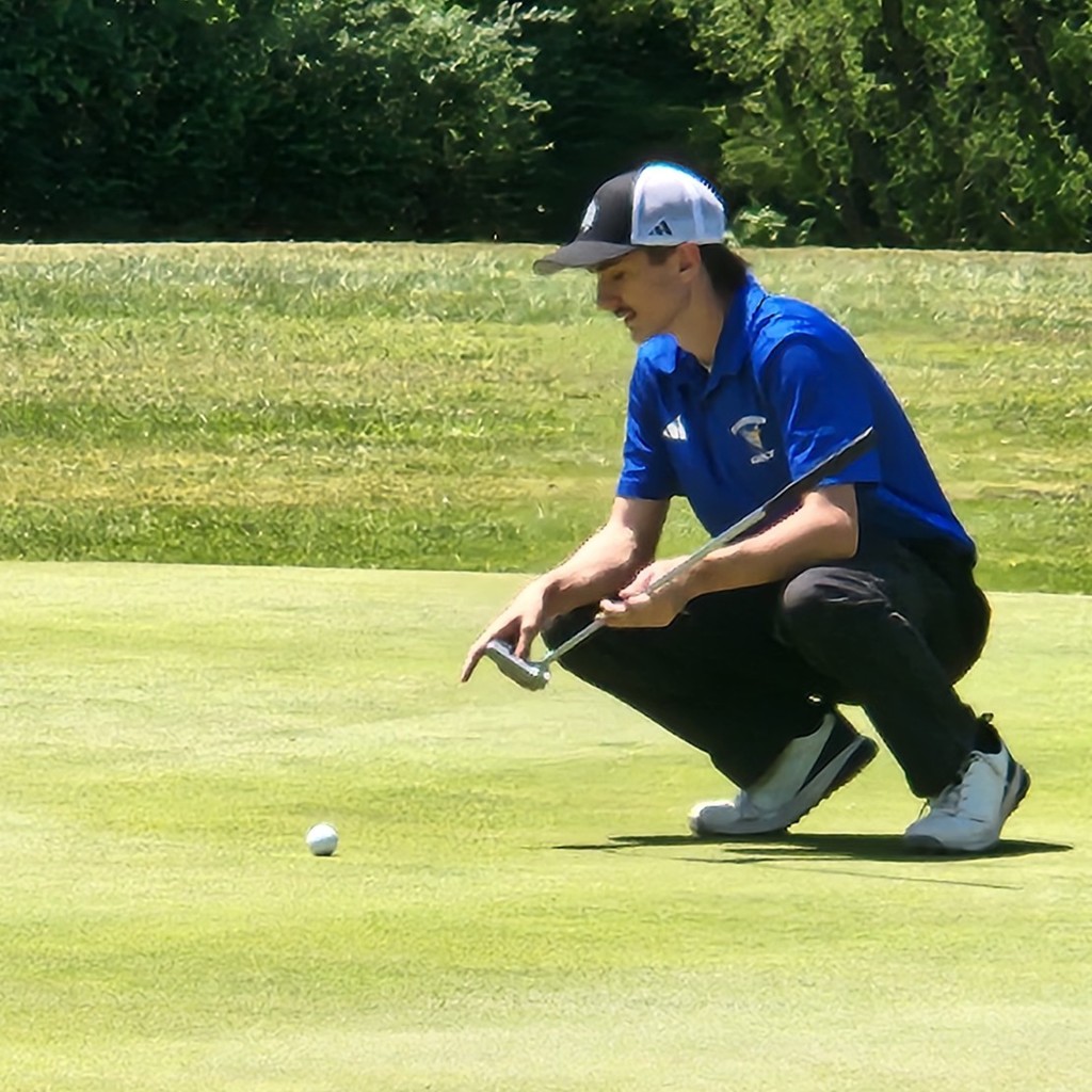 Brok McDaniel lining his putt up on number 5.