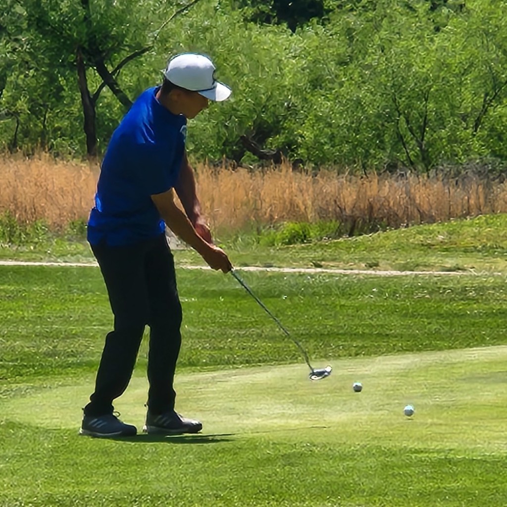 Grayson Bolt hits an uphill putt on number 4.
