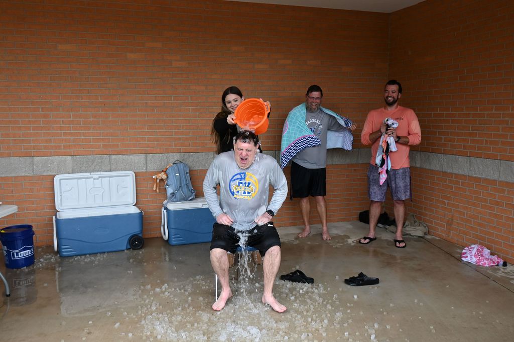 Barcus gets a pail of ice water dumped on his head.
