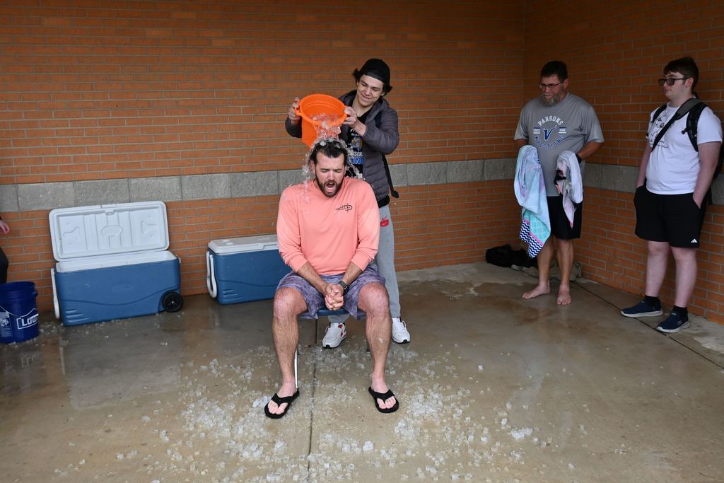 Thompson gets a pail of ice water dumped on him.