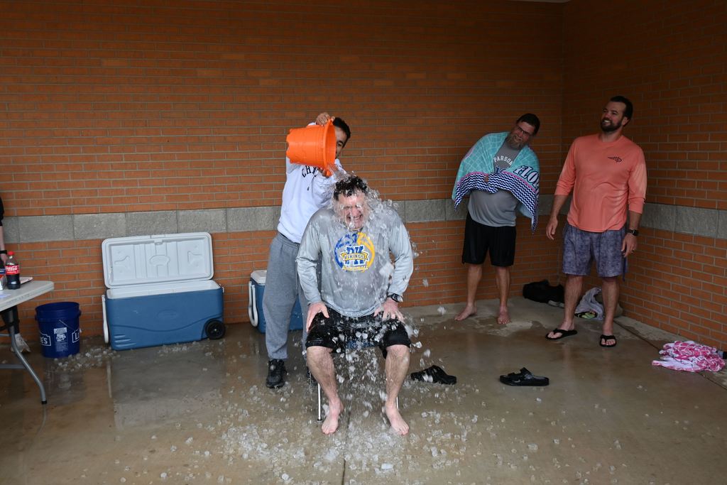 Barcus gets a pail of ice water dumped on his head.