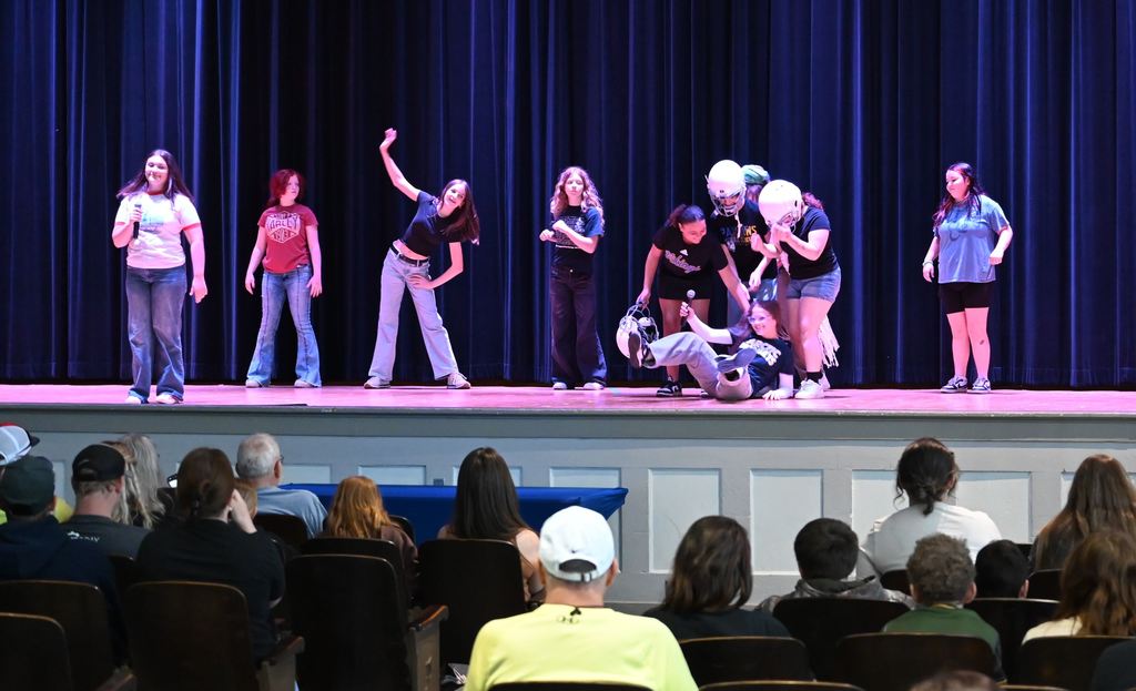 Students act out a scene involving athletics.