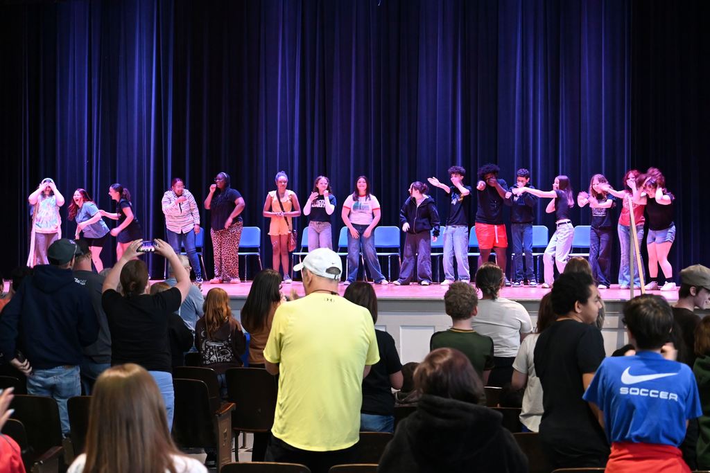 Students do a curtain call.