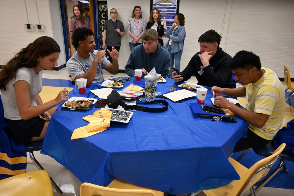 Seniors eat breakfast.