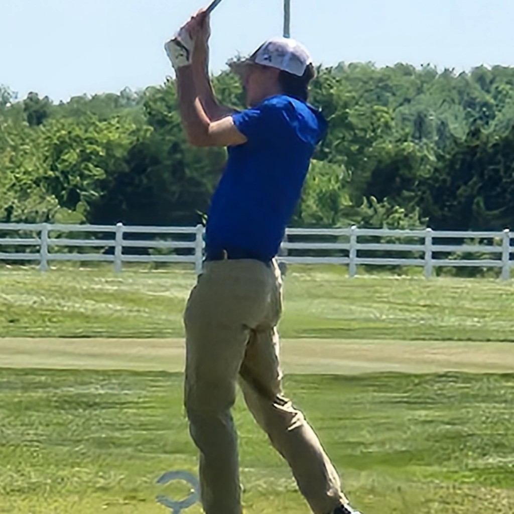 Brok McDaniel hits his tee shot on number 1.