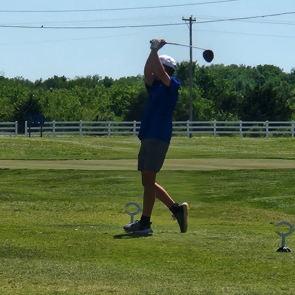 Kaison McRay hits his tee shot on number 1.