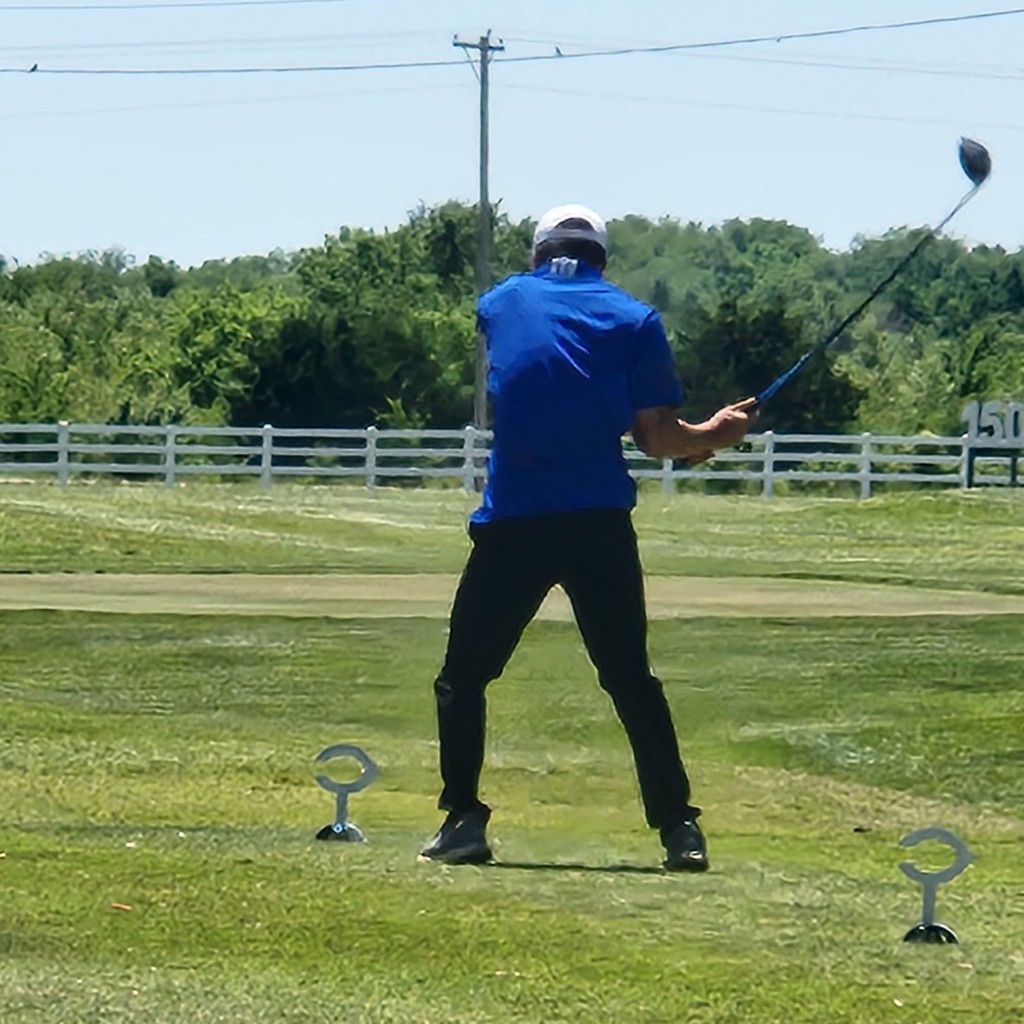 Grayson Bolt hits his tee shot on number 1. 