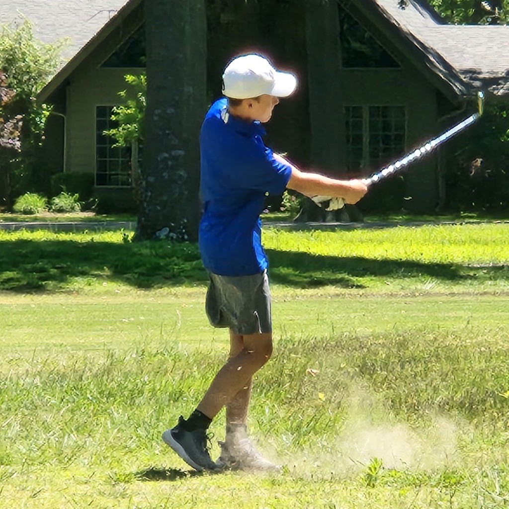 Kaison McRay chips on to the number 10 green.