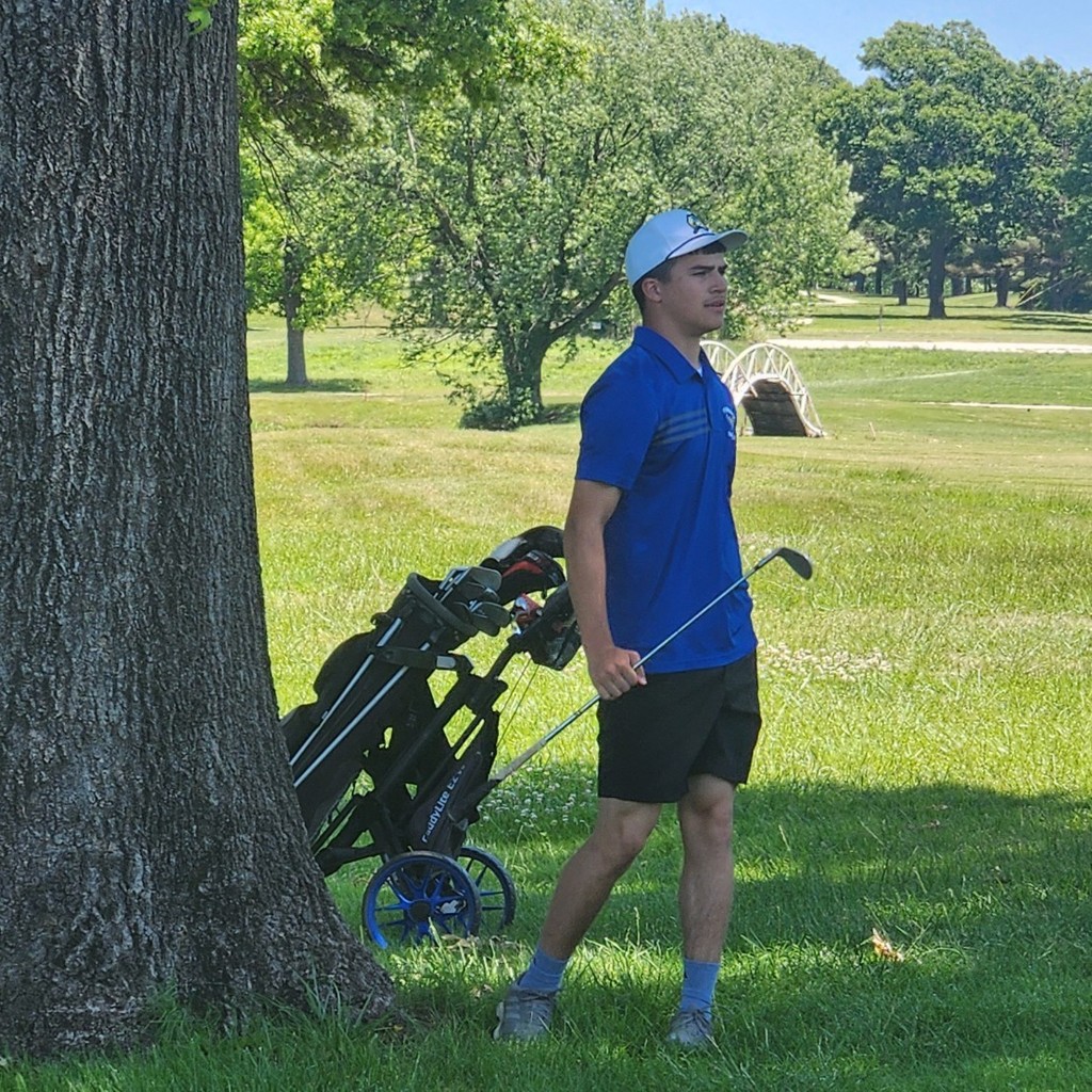 Grayson Bolt follows his chip shot on number 10.