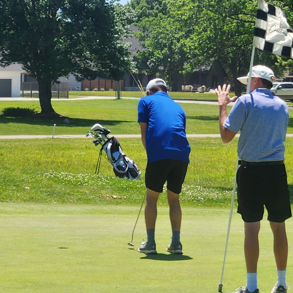 Grayson Bolt sinks his putt on number 10.