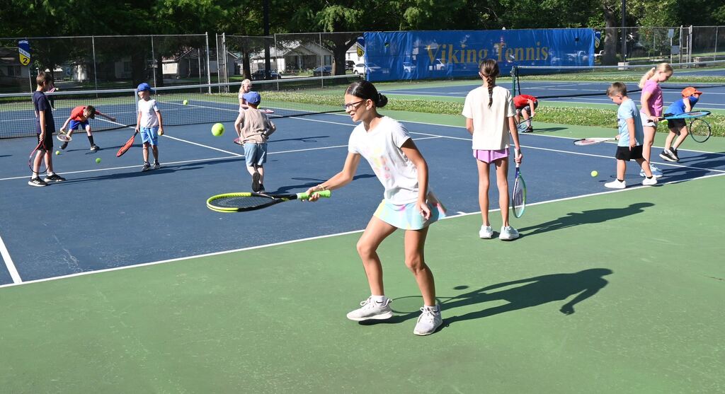 A girl practives controlling the ball.