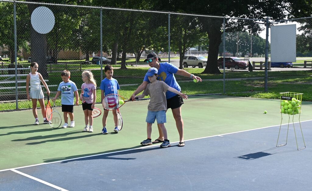Halee Kennet helps a boy with his form.